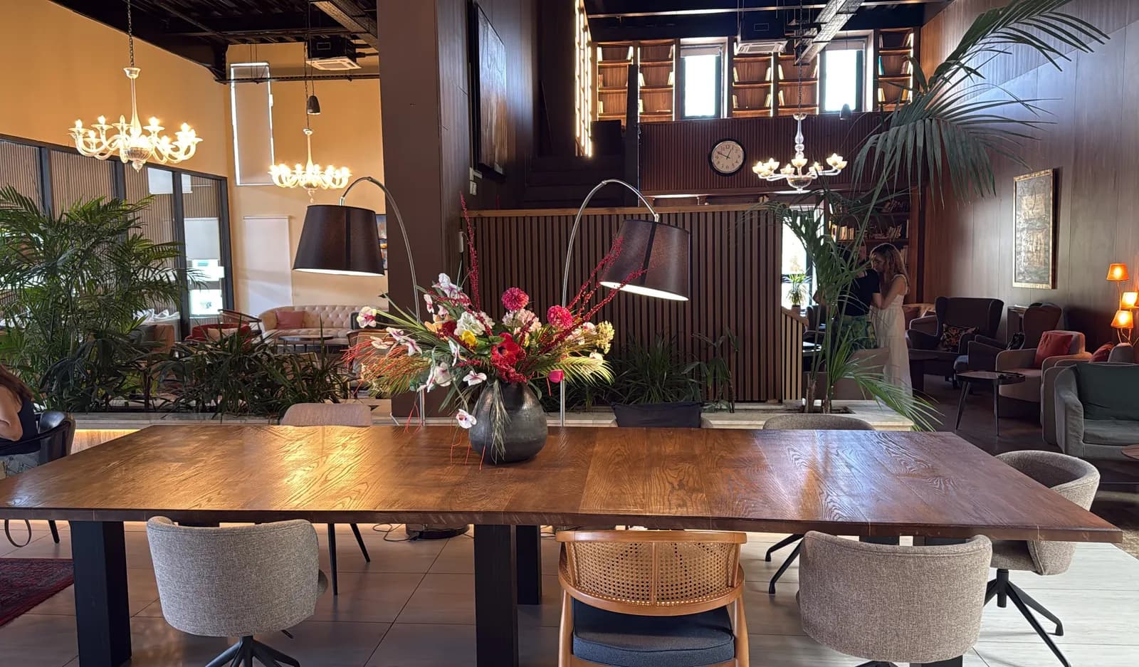 The long communal table with fresh flowers